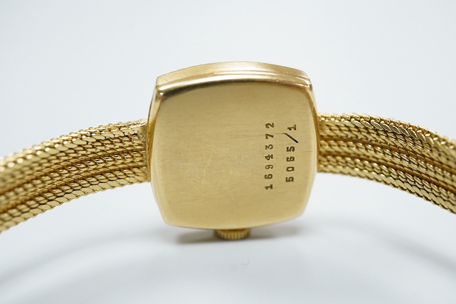 A lady's modern 18ct gold Cortebert manual wind wrist watch, with baton numerals, on 18ct gold integral strap, case diameter 18mm, overall length 17.7cm, gross weight 22 grams.